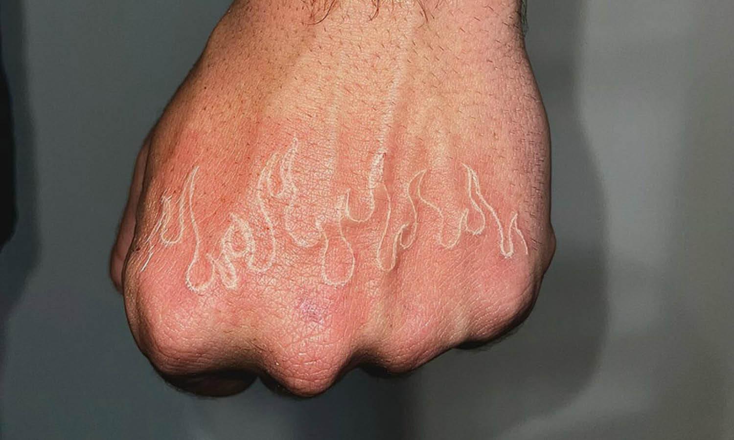 White Ink Tattoos on Black Skin: Bold & Beautiful